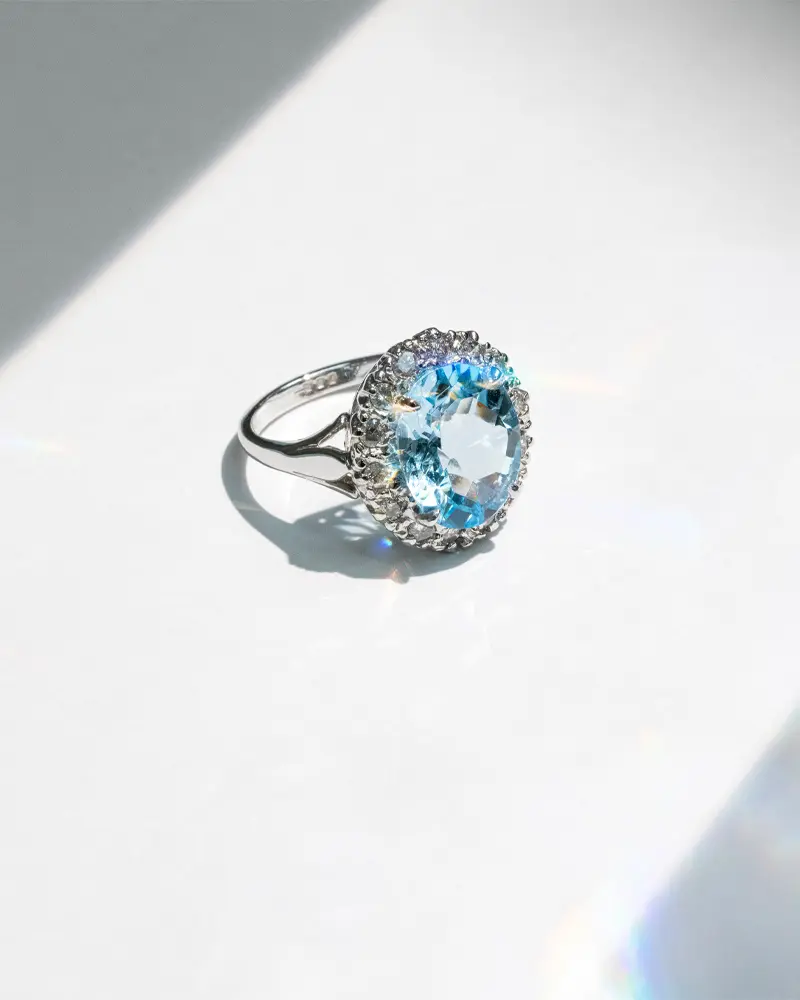 Bespoke aquamarine and diamond cluster ring in white gold