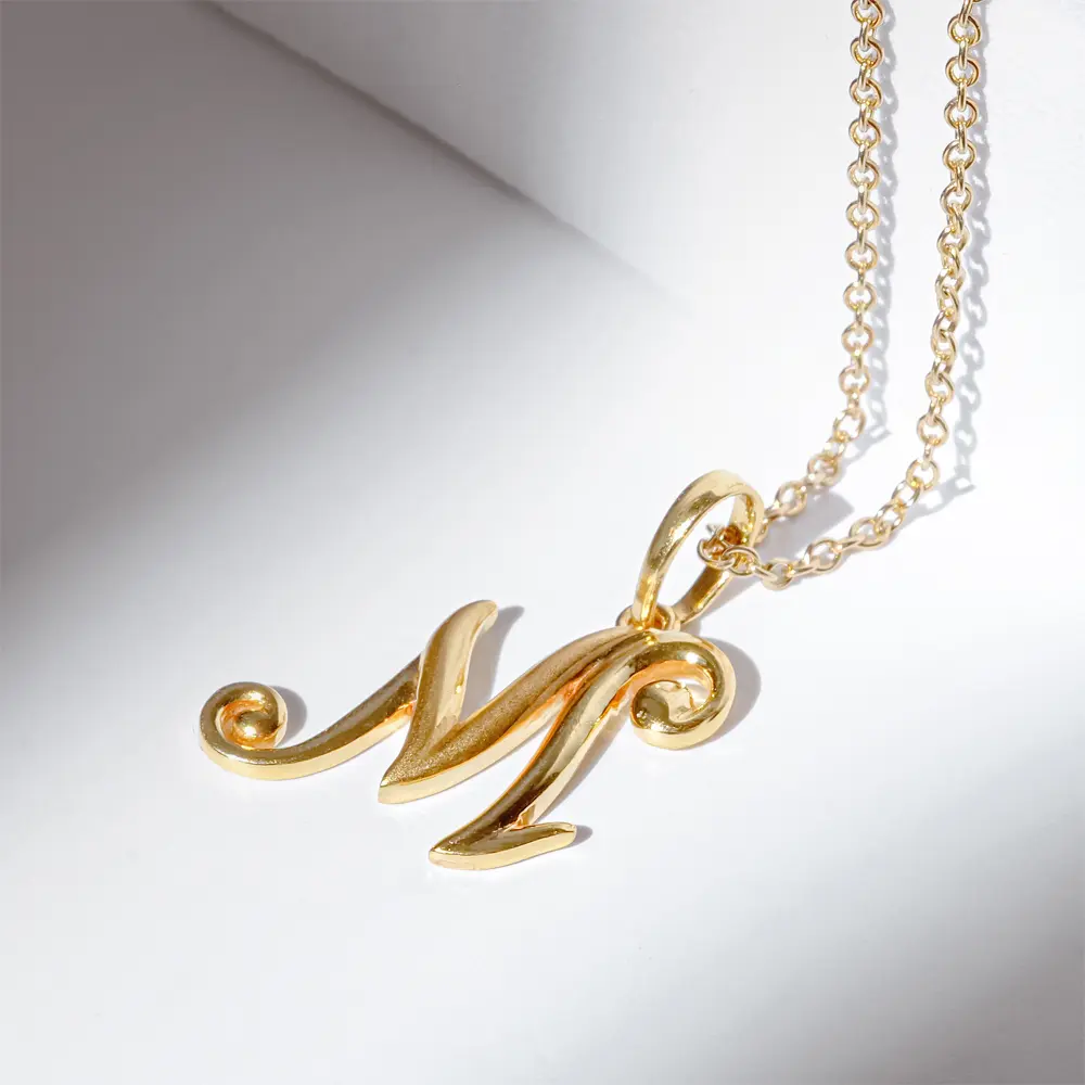 Bespoke initial M pendant in yellow gold